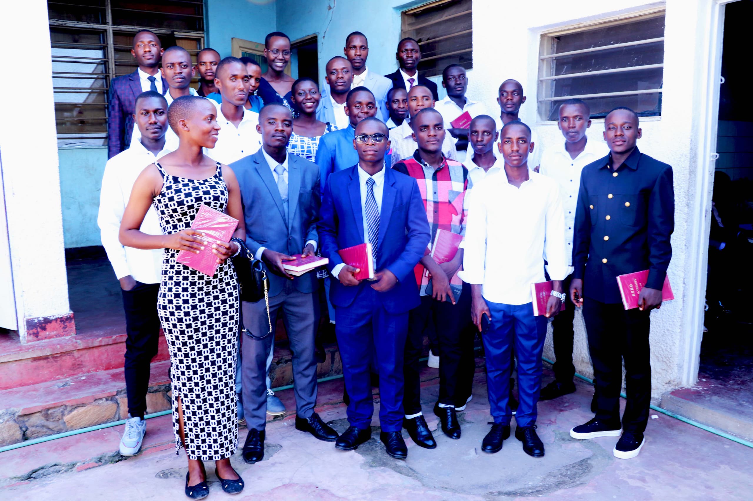 Indoor spiritual gathering with people engaged in prayer and worship during chaplaincy work