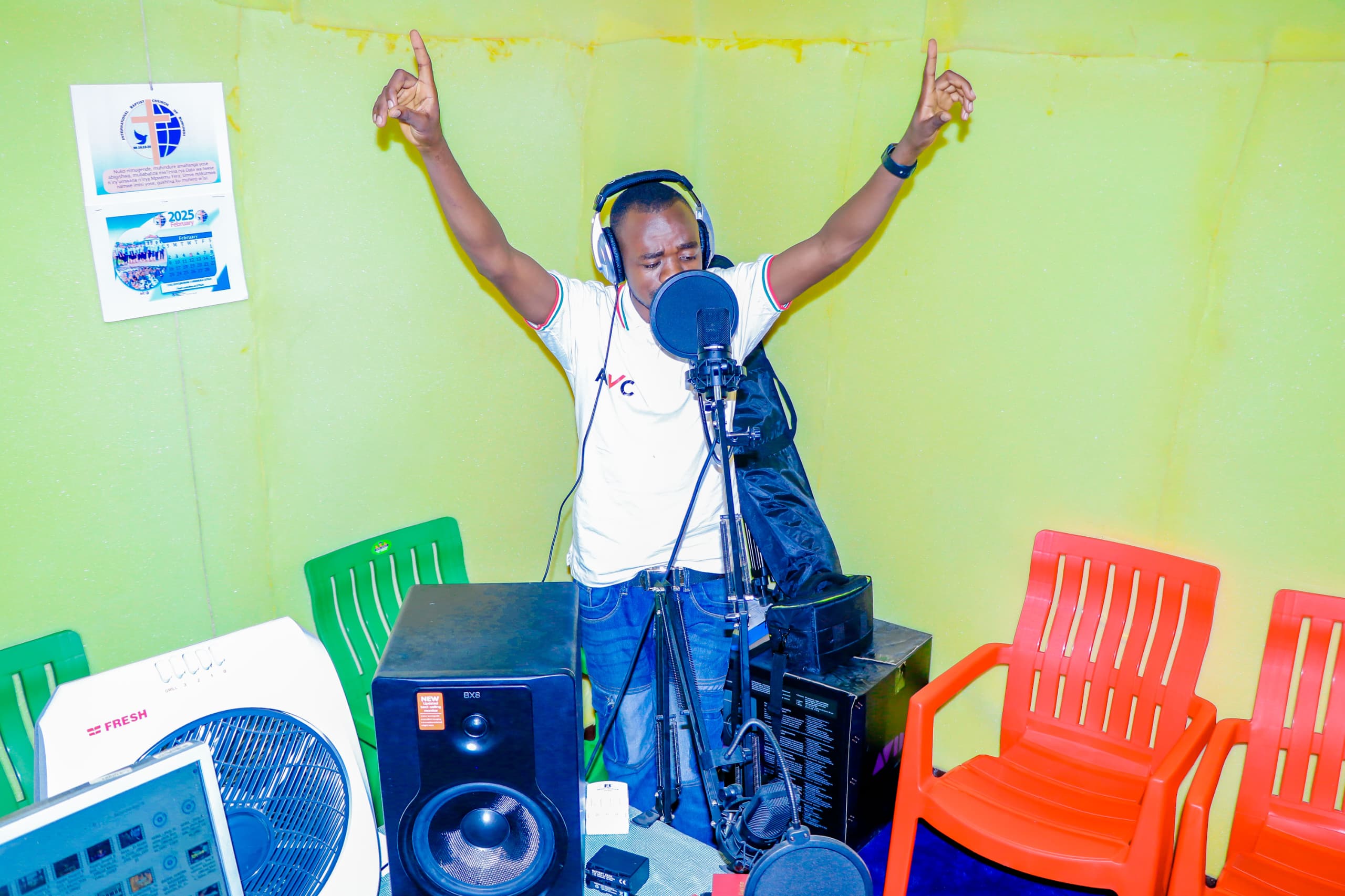 Young man recording music in studio, representing Kodesh Media talent development and production