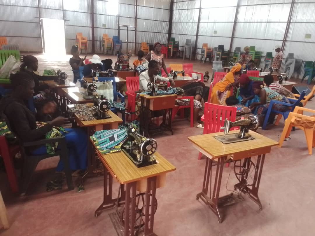 Women participating in sewing training program