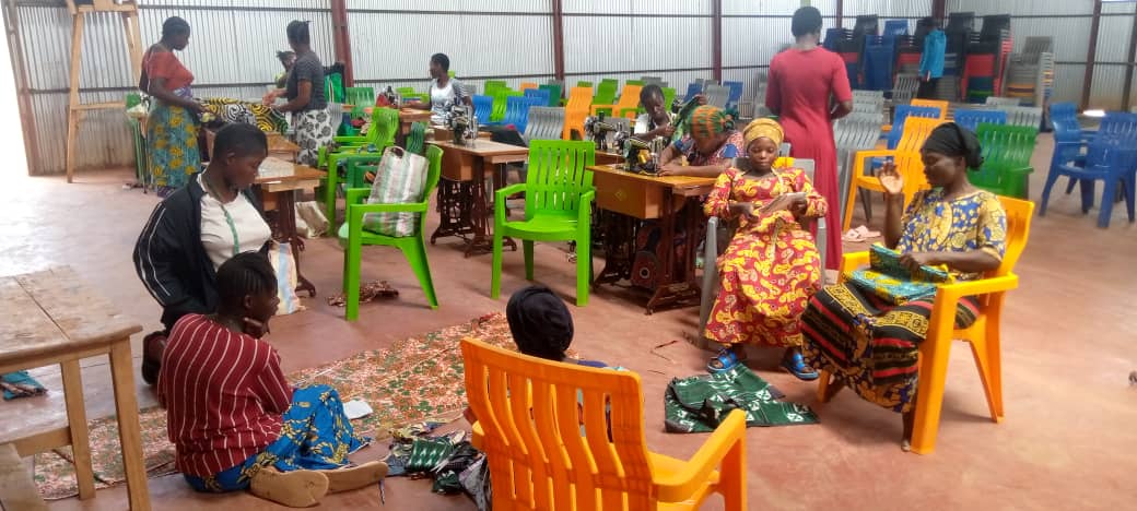 Women holding certificates at graduation ceremony